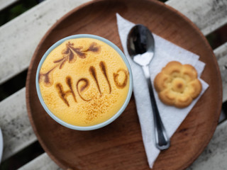 cup of coffee and cake on wooden table