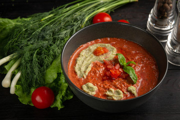 tomato cream soup in a black plate