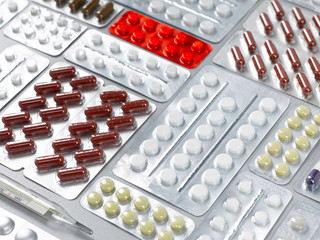 Closeup abstract background with scattered packages with medicines