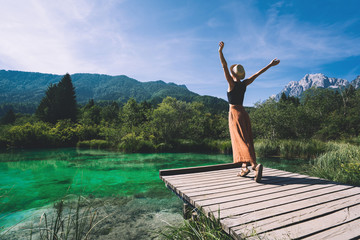 Woman enjoying freedom on nature outdoors. Travel Slovenia Europe.