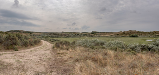 Panoramic view of a dune valley and a sandy path