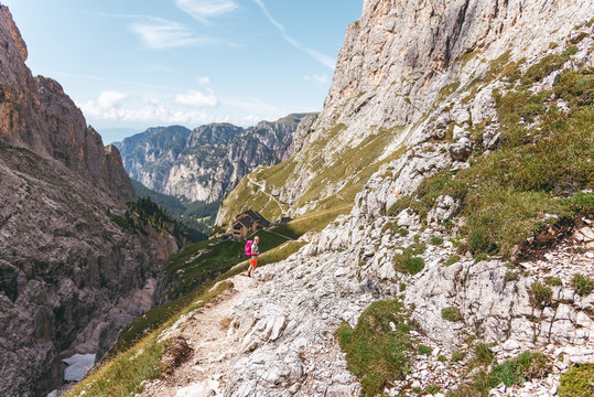 Hiker at rifugio bergamo in the Dolomites
