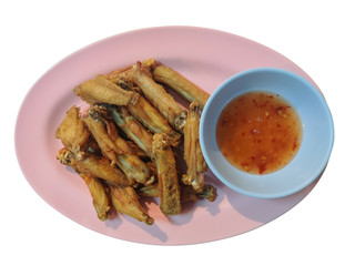 Fried chicken with sauce is a crispy and tasty on pink dish isolate on white background.