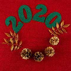 Happy New Year 2020. Decoration with green figures, cones and gold branches.