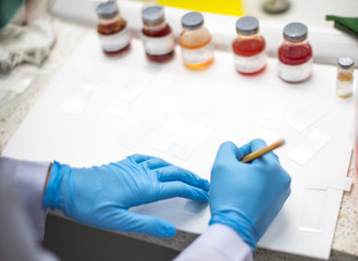 Scientists are preparing specimens for cytology to check for abnormalities in cells.