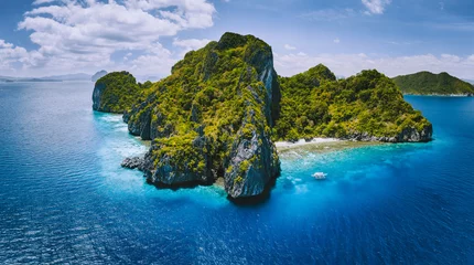 Foto op Canvas Aerial drone panorama view of tropical paradise island. Karst limestone rocky mountains surrounds by blue ocean and coral reef © Igor Tichonow
