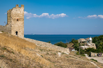 Fototapeta na wymiar Tower of Crisco (Genoese fortress) and the church of the Iveron icon of the Mother of God in Crimea, Feodosia