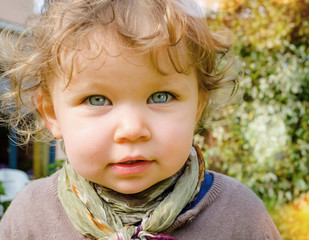 little girl exploring the garden in the spring