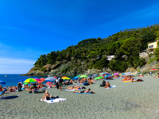 Fototapeta na wymiar The people resting at beach Bonassola.