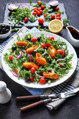 close-up of arugula crab clamps salad, top view
