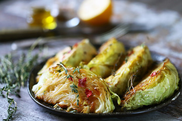 Baked cabbage slices. Autumn food. Vegan diet. Selective focus. Macro.
