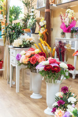 Colorful peony, roses and other flowers in a flower shop .