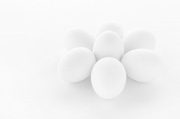 fresh white eggs on white background, closeup