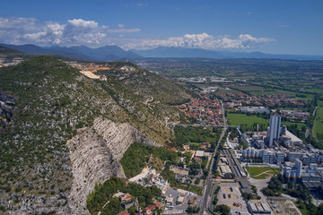 Air view of a marble quarry. Panoramic view of the extraction of marble in the quarry. Technique in the marble quarry of Brescia, Italy. Open pit mine.