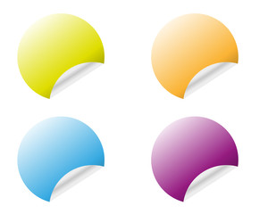 Round stickers with curled edge in different colors variants isolated on white background