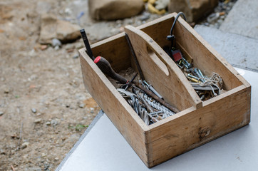 Box of building tools in the garden at the building of a house
