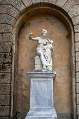 Fototapeta na wymiar FLORENCE, TUSCANY/ITALY - OCTOBER 20 : Broken statue of a woman and her baby in Boboli Gardens Florence on October 20, 2019