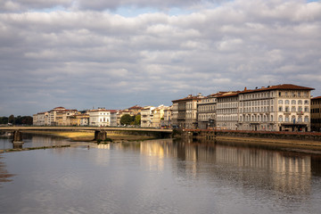 FLORENCE, TUSCANY/ITALY - OCTOBER 20 : View of buildings along and across the River Arno in Florence  on October 20, 2019. Unidentified people.