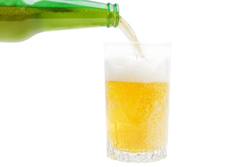 Closeup image of pouring beer from bottle into glass isolated on white