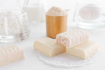 protein products such as whey powder, snack bar and egg with milk and curd