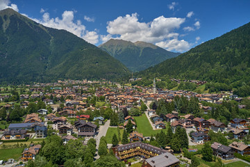 Fototapeta premium Aerial view of the ski resort Pinzolo, italy. Morning. In the background a clear blue sky