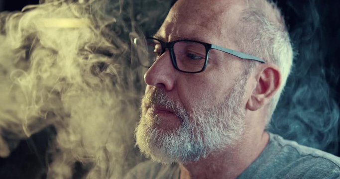 Man smoking a controversial vape is a health risk