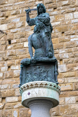 Obraz premium FLORENCE, TUSCANY/ITALY - OCTOBER 19 : Statue of Judith and Holofernes by Donatello in Piazza della Signoria in front of the Palazzo Vecchio Florence on October 19, 2019