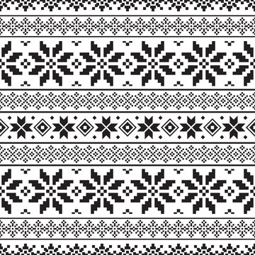 Knitted Christmas Ethnic pattern on white background. Ornament. Border. Seamless sample. It can be used as a background. Vector illustration.
