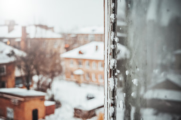 Window view of a snowy provincial town