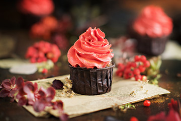 cupcakes with orange cream in the style of autumn and Halloween