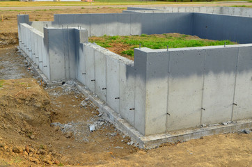 Concrete foundation and basement walls complete ready for next part of construction for new residential building.