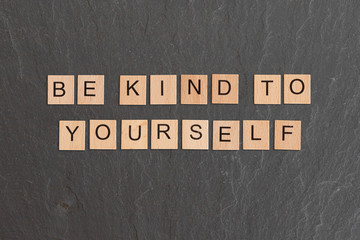 Be Kind To Yourself Written With Game Tiles
