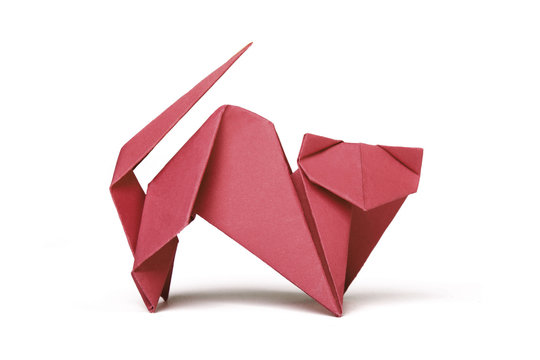 Small red brown origami cat on a white background