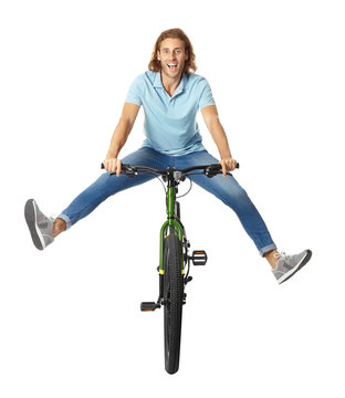 Happy Young Man Riding Bicycle On White Background