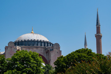 Fototapeta na wymiar Istanbul, Turkey: a view of Hagia Sophia, the famous former Greek Orthodox Christian patriarchal cathedral, later an Ottoman imperial mosque and now a museum, seen from Sultan Ahmet Park