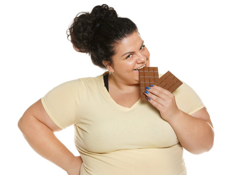 Happy Overweight Woman With Chocolate On White Background