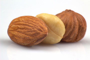 Nuts closeup on white background. Healthy food and vitamins.