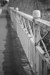 Old bridge with fencing and sidewalk, bw