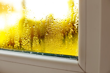 Window drip due to bad ventilation inside house. Condensation on glass during cold weather. High humidity is cause of mold (mildew, mould) on house or building surfaces. Water drop tracks on windows. - obrazy, fototapety, plakaty