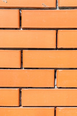 Obraz premium Textured background new brickwork close-up orange brick