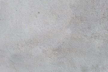 Gray textured cement wall background with fine concrete chips. Construction backgrounds - obrazy, fototapety, plakaty