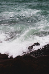 waves crashing on rocks