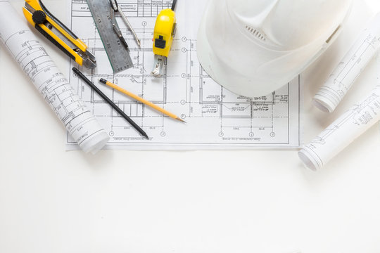 architect design working drawing sketch plans blueprints and making architectural construction model in architect studio,flat lay long banner
