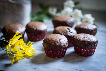 Still life food - Pastry - composition of muffins - with with flowers - selective focus