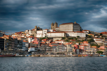 Fototapeta na wymiar Porto city, Portugal, Panoramic view of the historic center on a hill from the Douro River Embankment