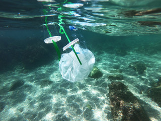 Plastic bags and bottles pollution in ocean © Krafla
