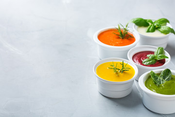 Set of seasonal fall autumn creamy soups on a table