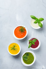 Set of seasonal fall autumn creamy soups on a table