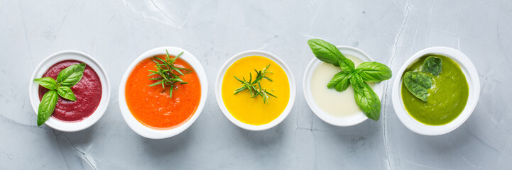 Set of seasonal fall autumn creamy soups on a table