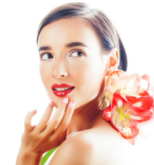 young pretty brunette real woman with red flower amaryllis closeup isolated on white background. Fancy fashion makeup, bright lipstick, creative Ombre manicured nails